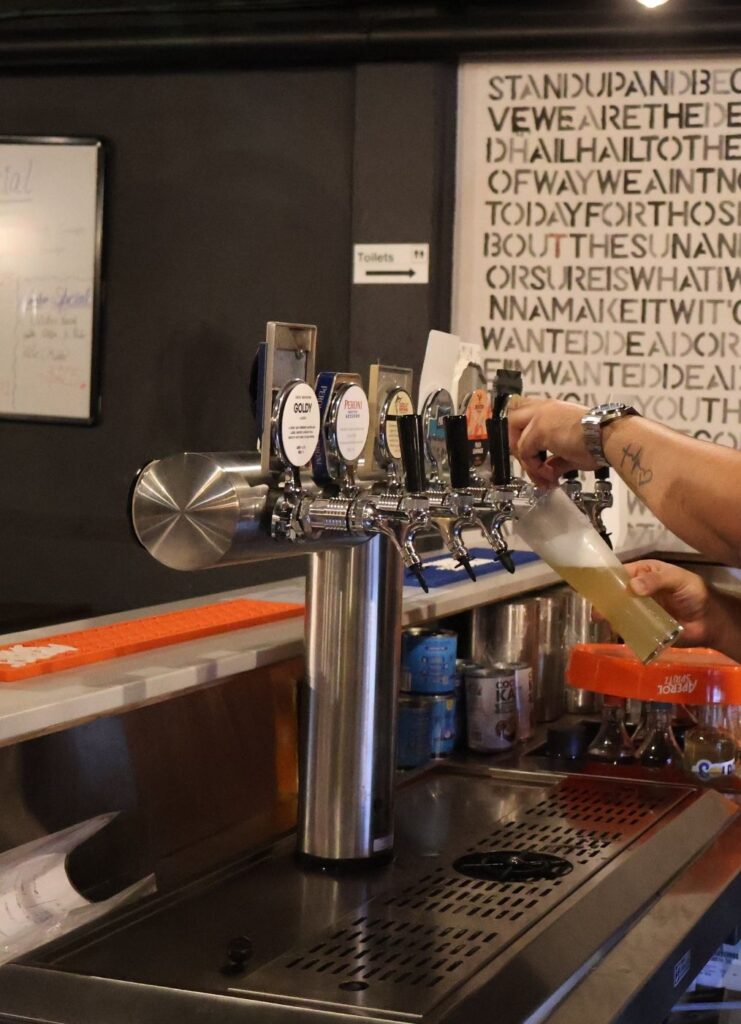 Tap beer being poured at Neighborhood Pizza, Mount Hawthorn